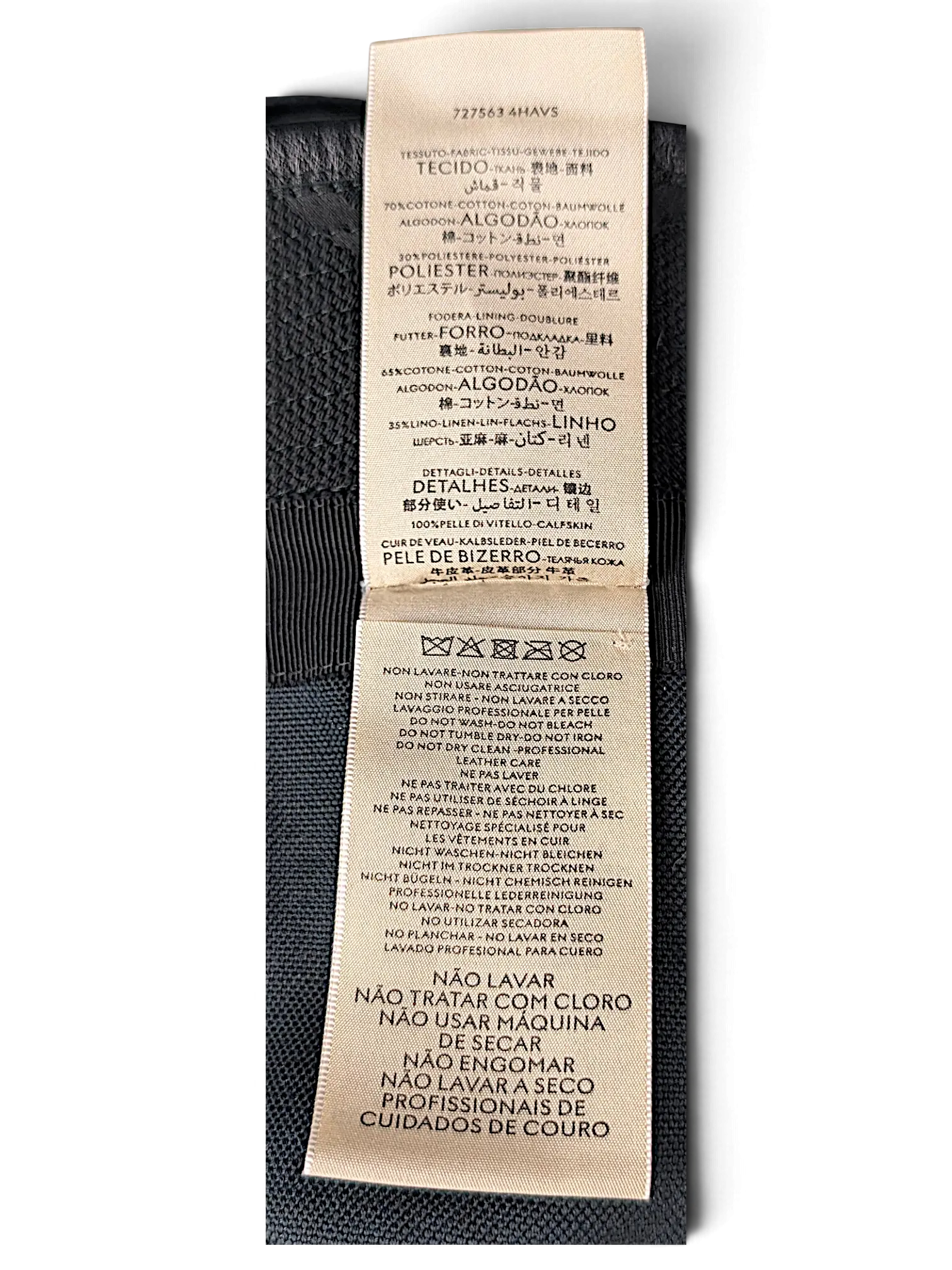 JAKE & IPI Gucci bucket hat care label showing material composition of cotton, polyester, linen, and calfskin leather