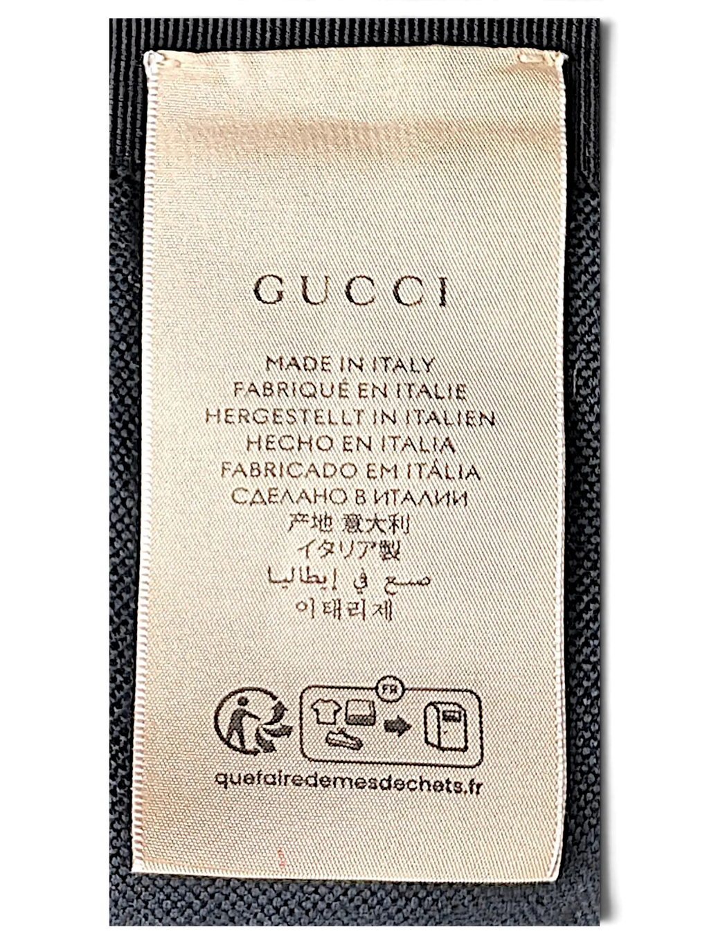JAKE & IPI Gucci bucket hat interior fabric care label with Made in Italy text and recycling instructions