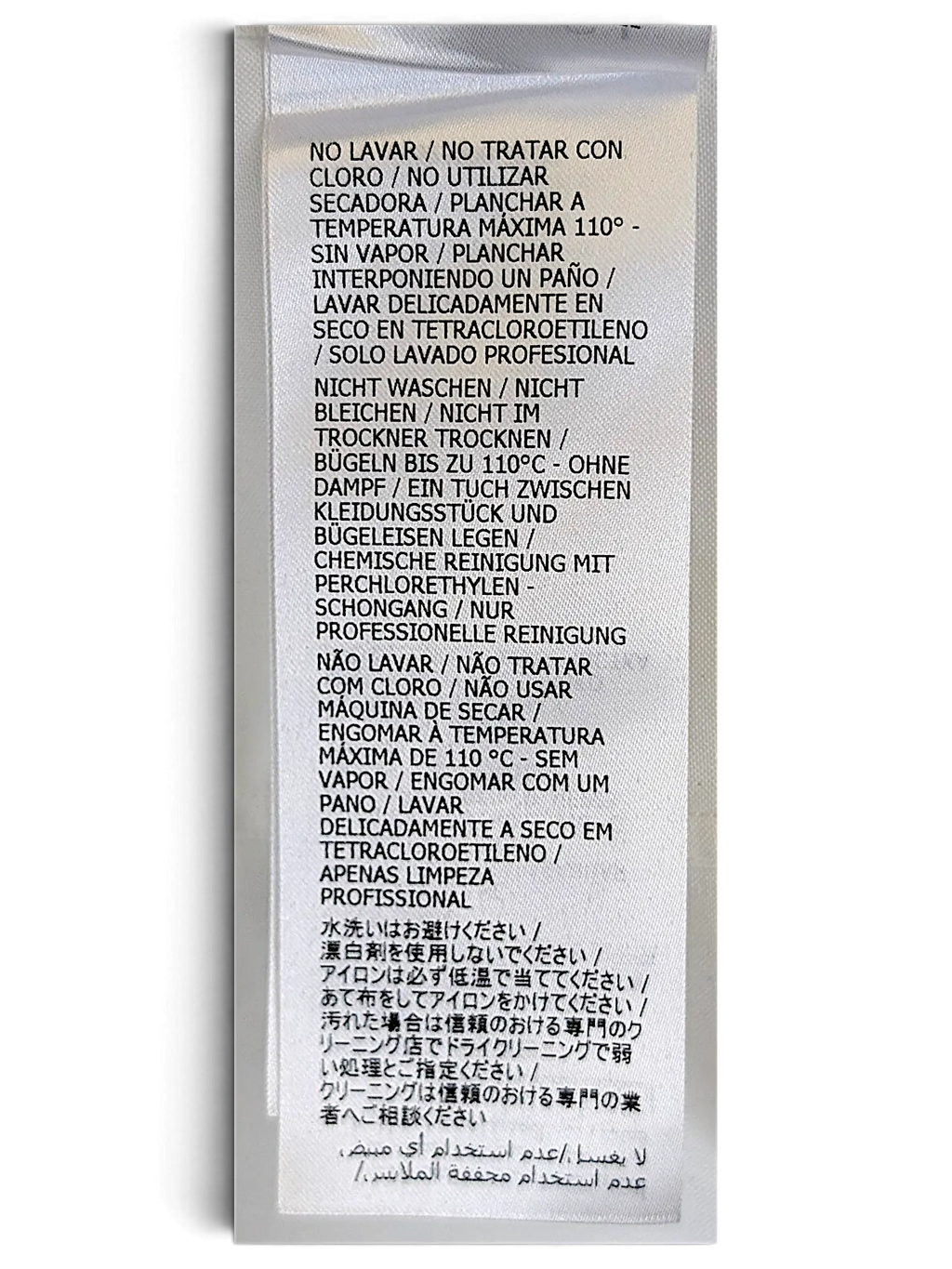 JAKE & IPI Gucci shirt white fabric care label with multi-language washing instructions