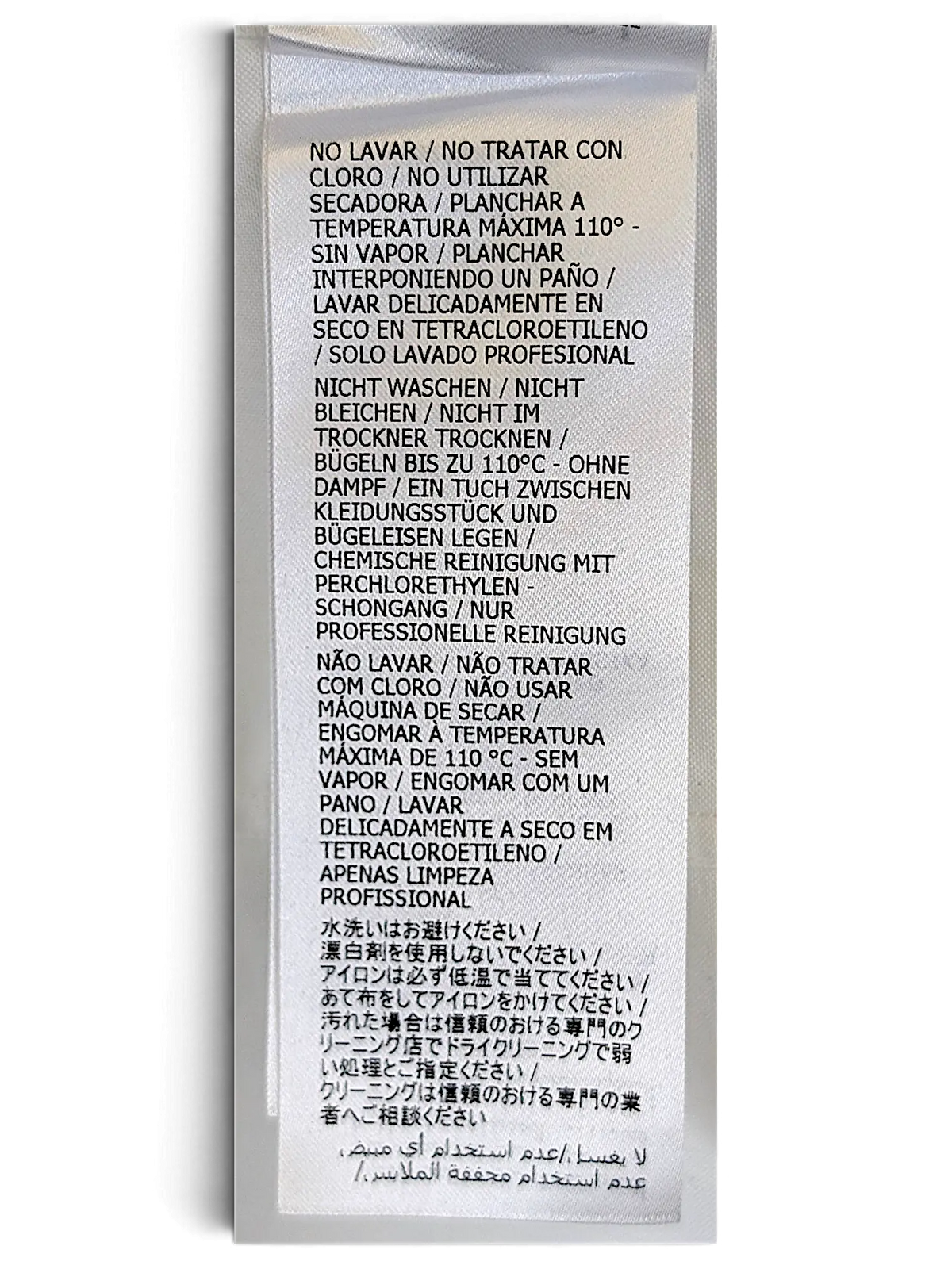 JAKE & IPI Gucci shirt white fabric care label with multi-language washing instructions