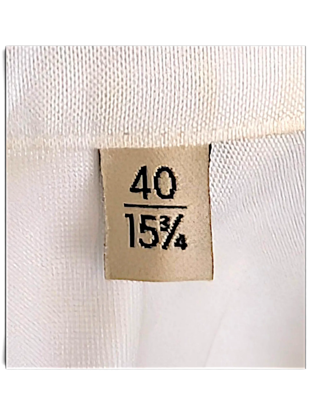 JAKE & IPI IBE Gucci shirt size label showing 40 and 15 3/4 measurements on a white fabric background