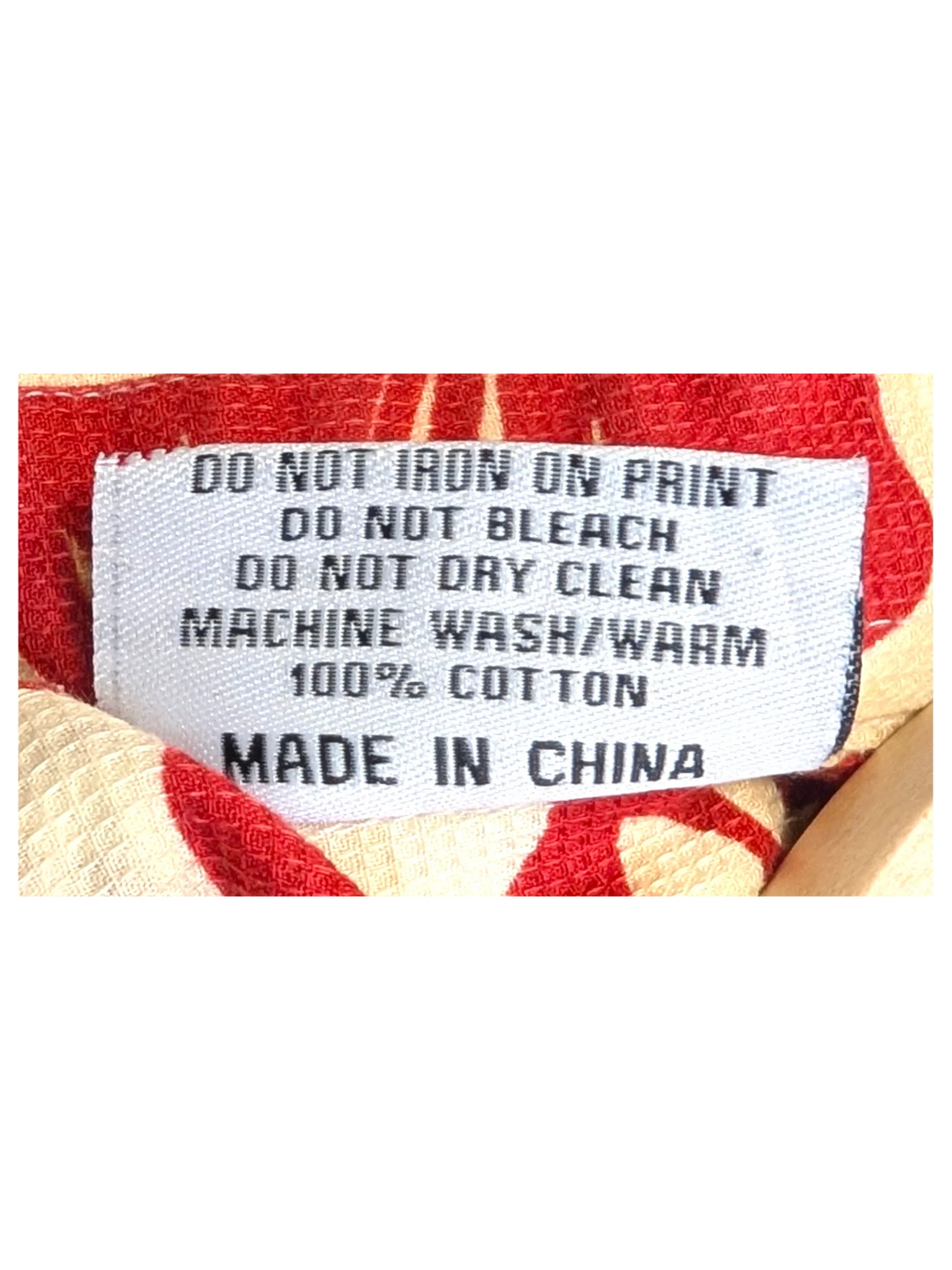 JAKE & IPI Teahupoo Tahiti Hawaiian shirt care label showing 100% cotton material and washing instructions