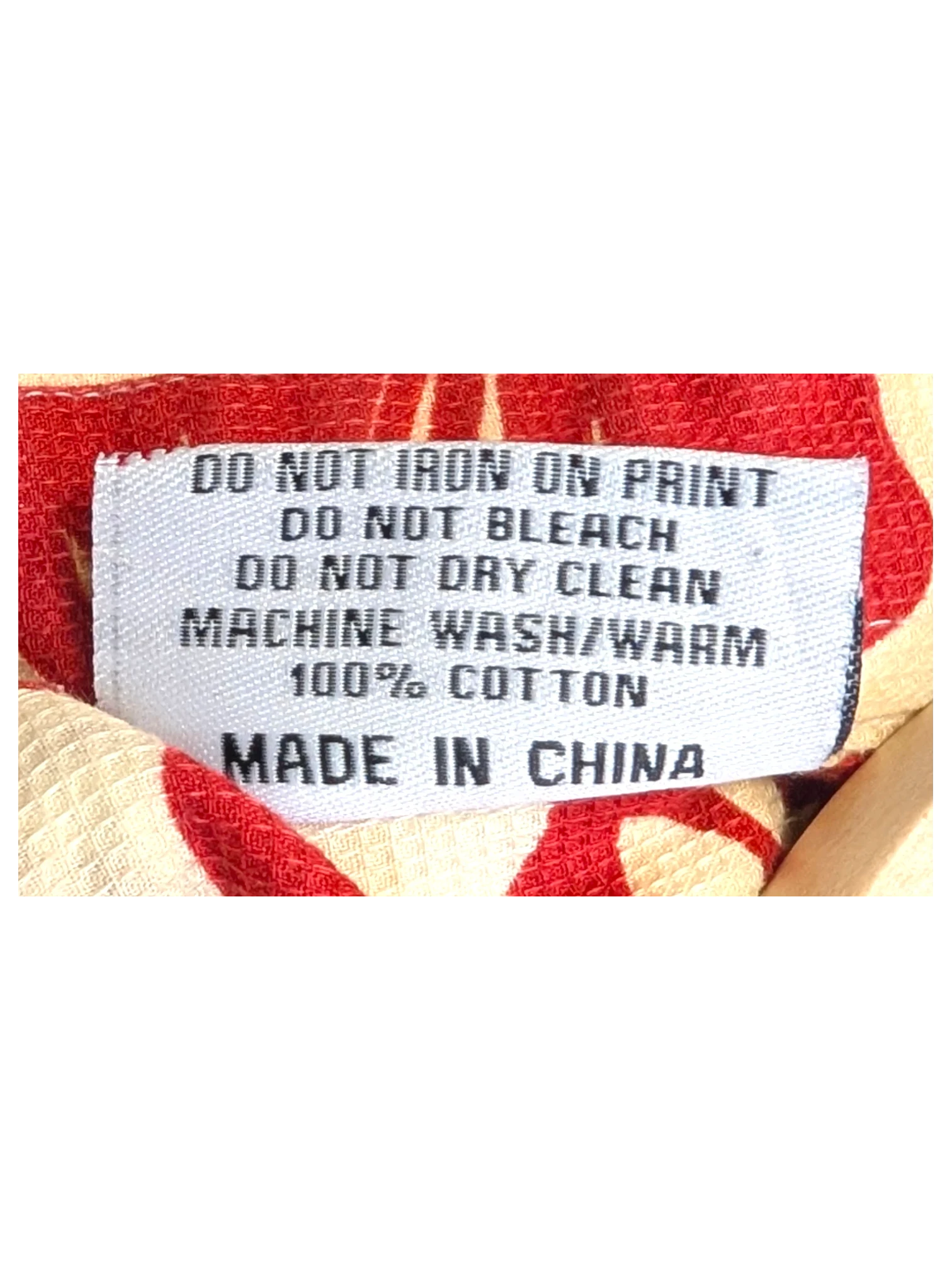 JAKE & IPI Teahupoo Tahiti Hawaiian shirt care label showing 100% cotton material and washing instructions