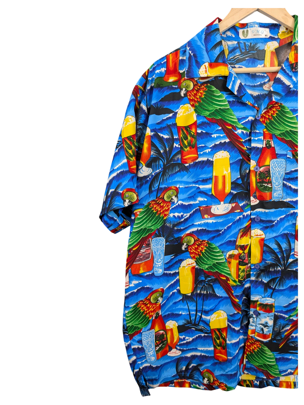JAKE & IPI V.H.O Hawaiian shirt featuring a vibrant blue tropical print with parrots, palm trees, and beer glasses.