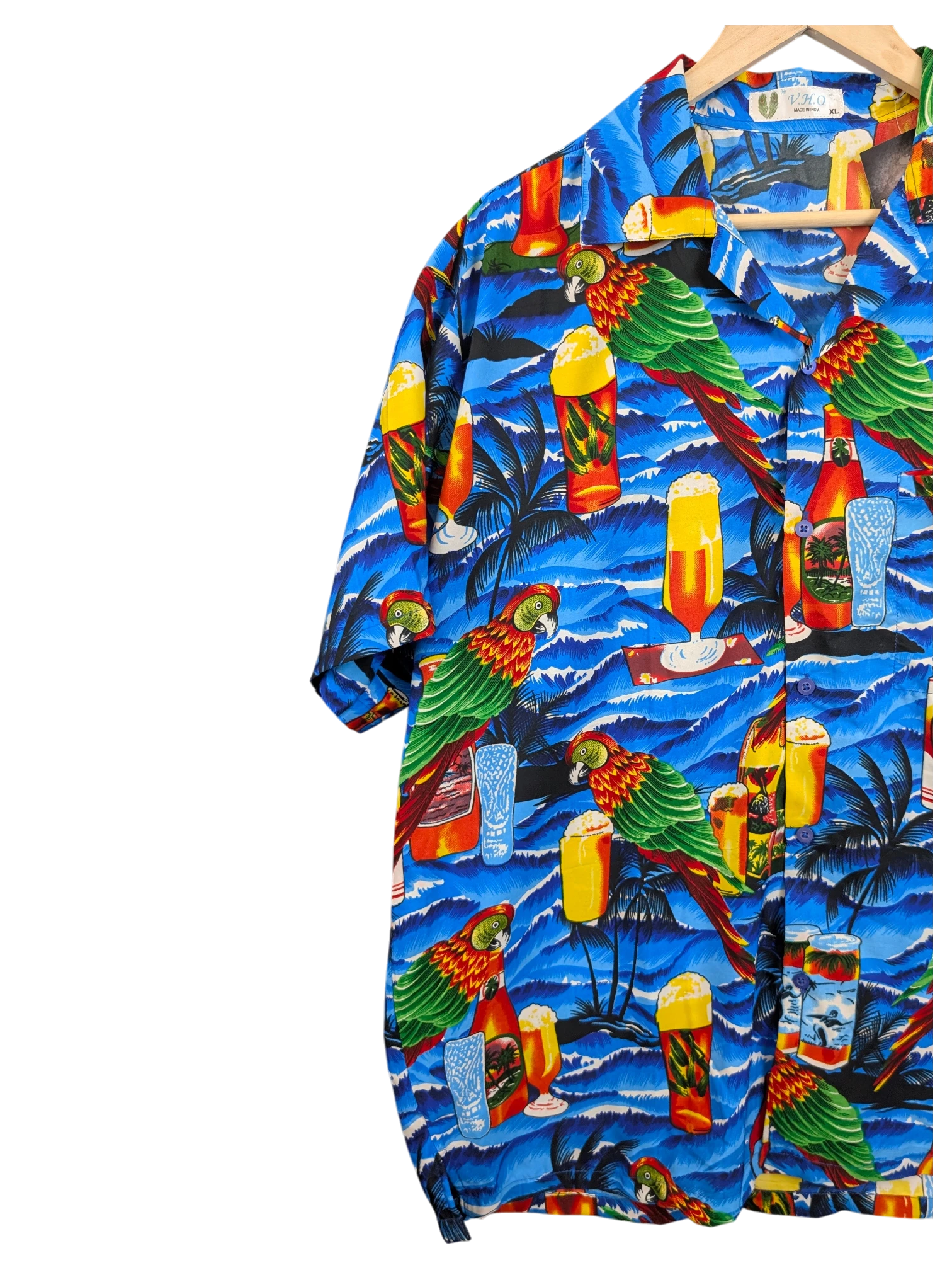JAKE & IPI V.H.O Hawaiian shirt featuring a vibrant blue tropical print with parrots, palm trees, and beer glasses.