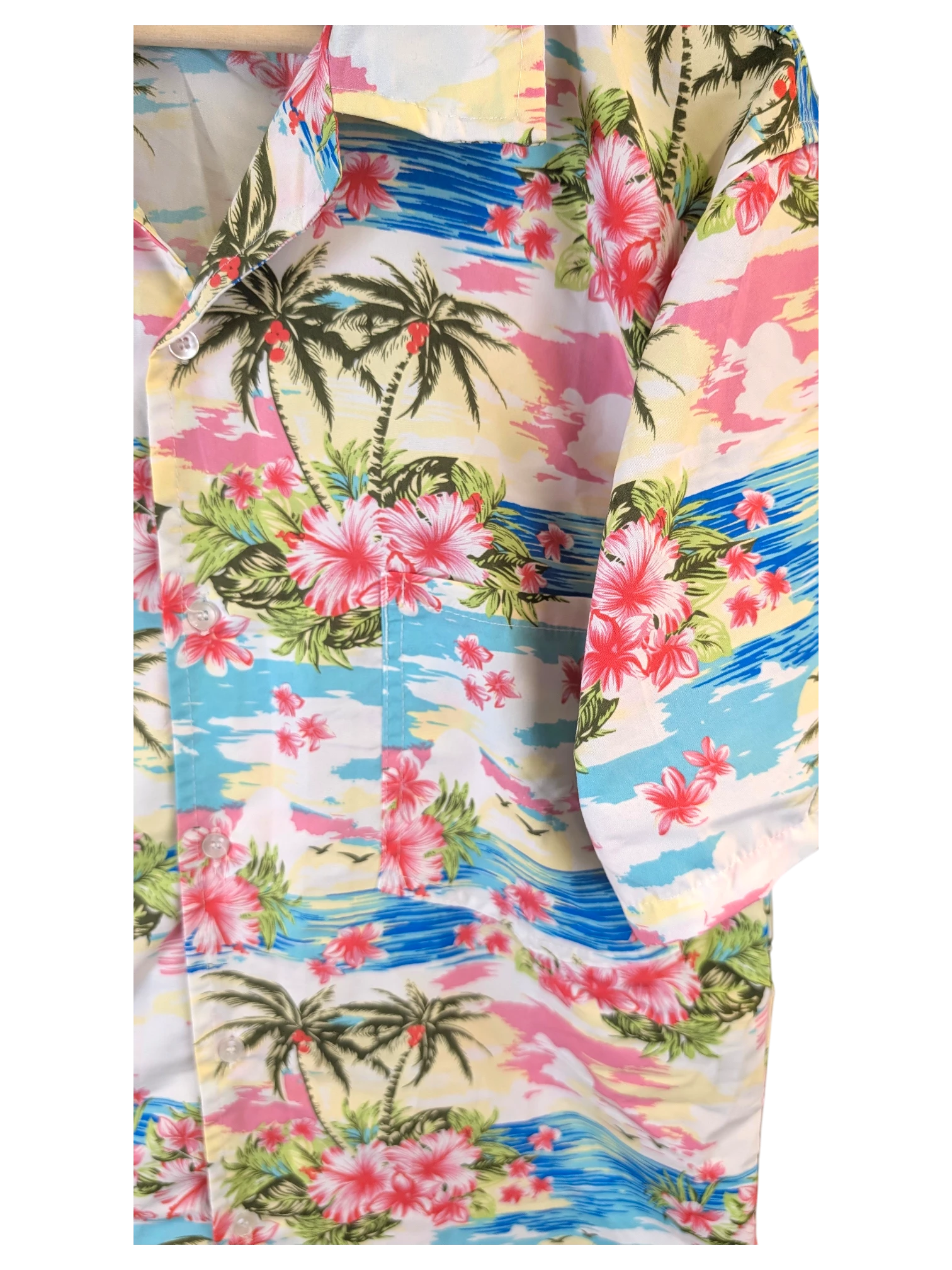 JAKE & IPI Hawaiian shirt featuring a vibrant tropical print with palm trees, pink hibiscus flowers, and blue ocean.