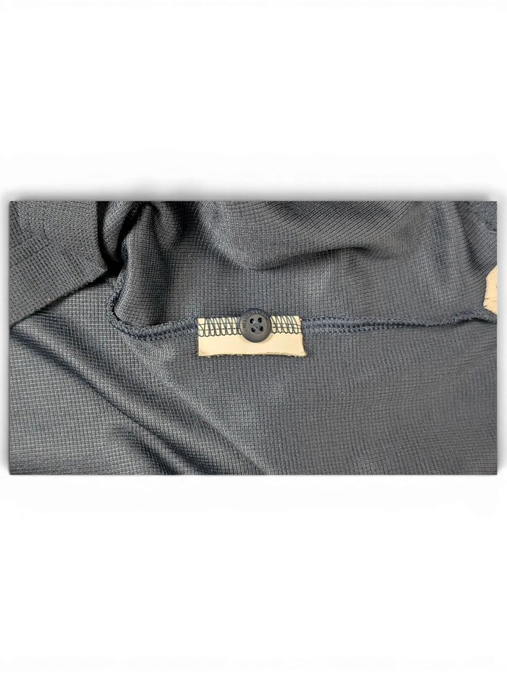 JAKE & IPI pre-owned Helly Hansen navy polo shirt featuring a textured fabric and branded button detail