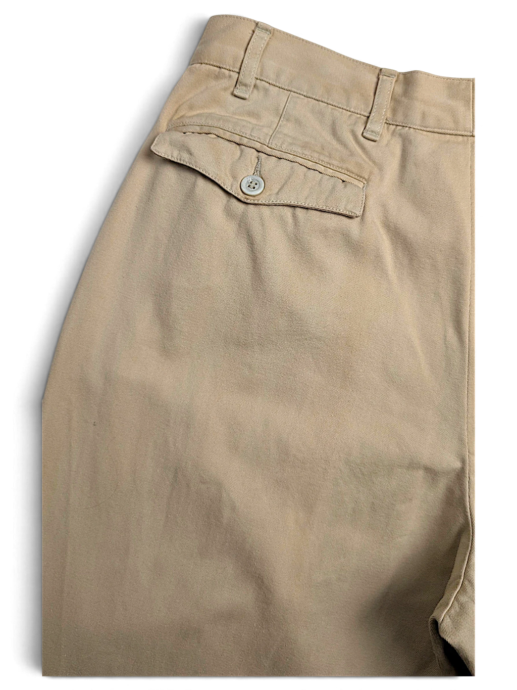 JAKE & IPI Hilton Boutique beige pleated trousers featuring a tailored waistband and a buttoned back pocket.