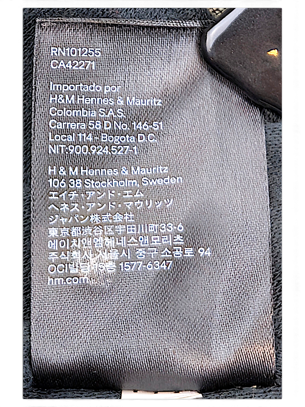 H&M L.O.G.G. Olive Green Bomber Jacket; Product and manufacturing information label.
