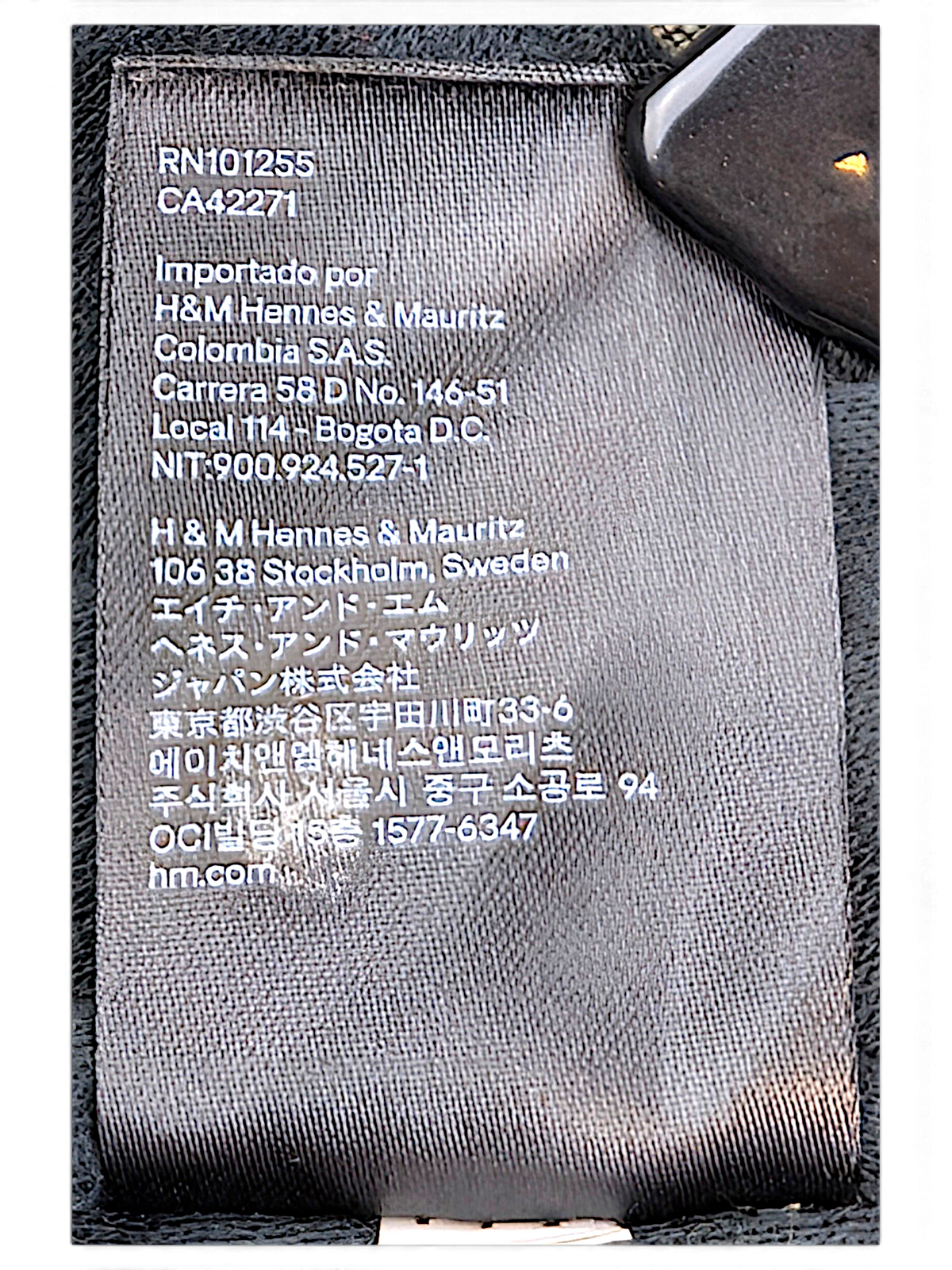 H&M L.O.G.G. Olive Green Bomber Jacket; Product and manufacturing information label.