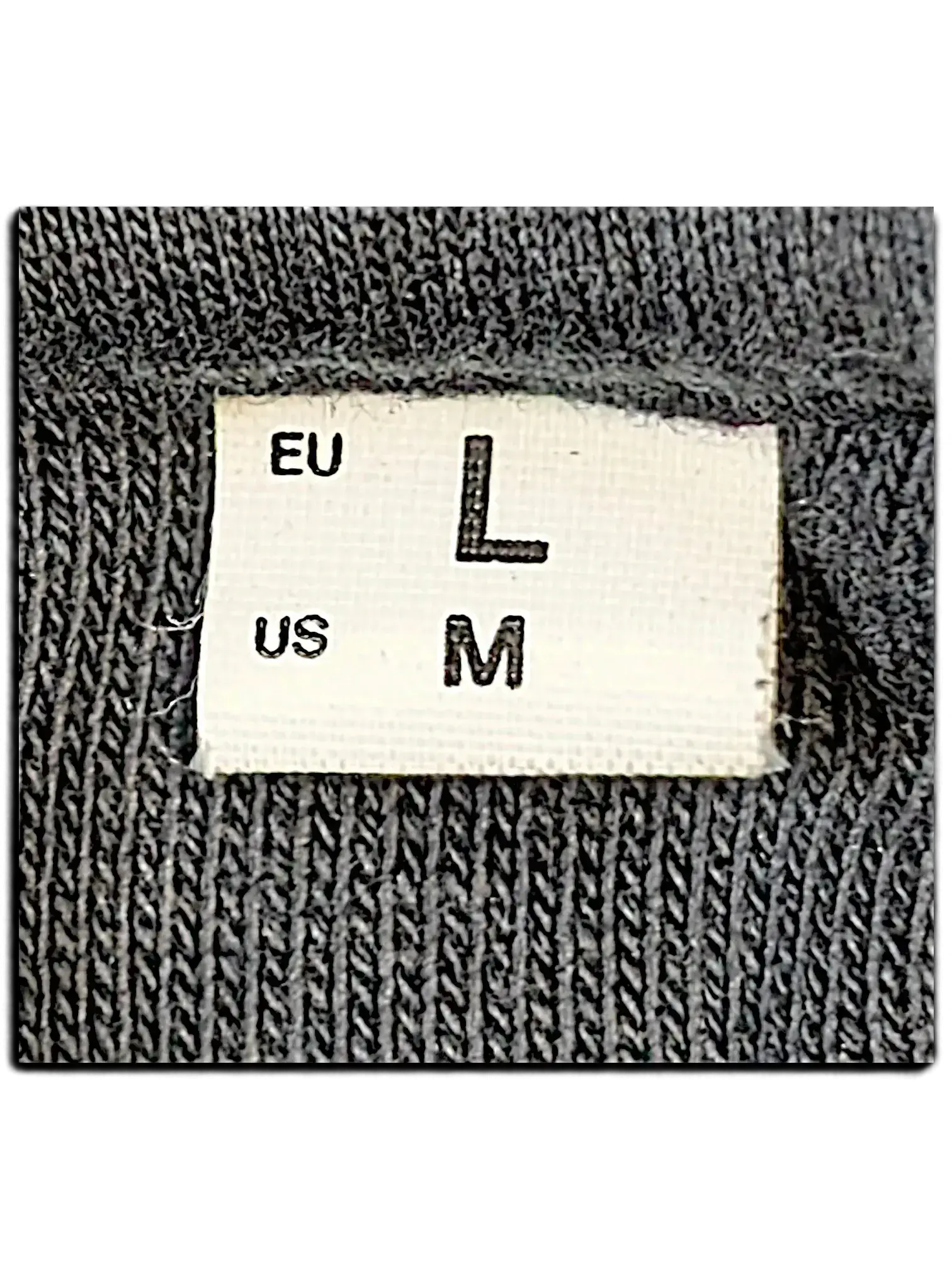 JAKE & IPI IBE Pyzze Hoodie interior neck label showing EU size L and US size M on dark grey fabric
