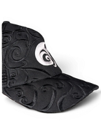 JAKE & IPI IBE Morivelle cap in black with intricate tonal embroidery and a prominent white circular logo detail