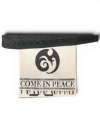 JAKE & IPI IBE Morivelle cap interior fabric label with Come In Peace branding and logo