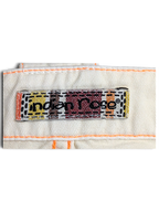 JAKE & IPI Indian Rose white cargo pants brand label with orange contrast stitching on cotton fabric
