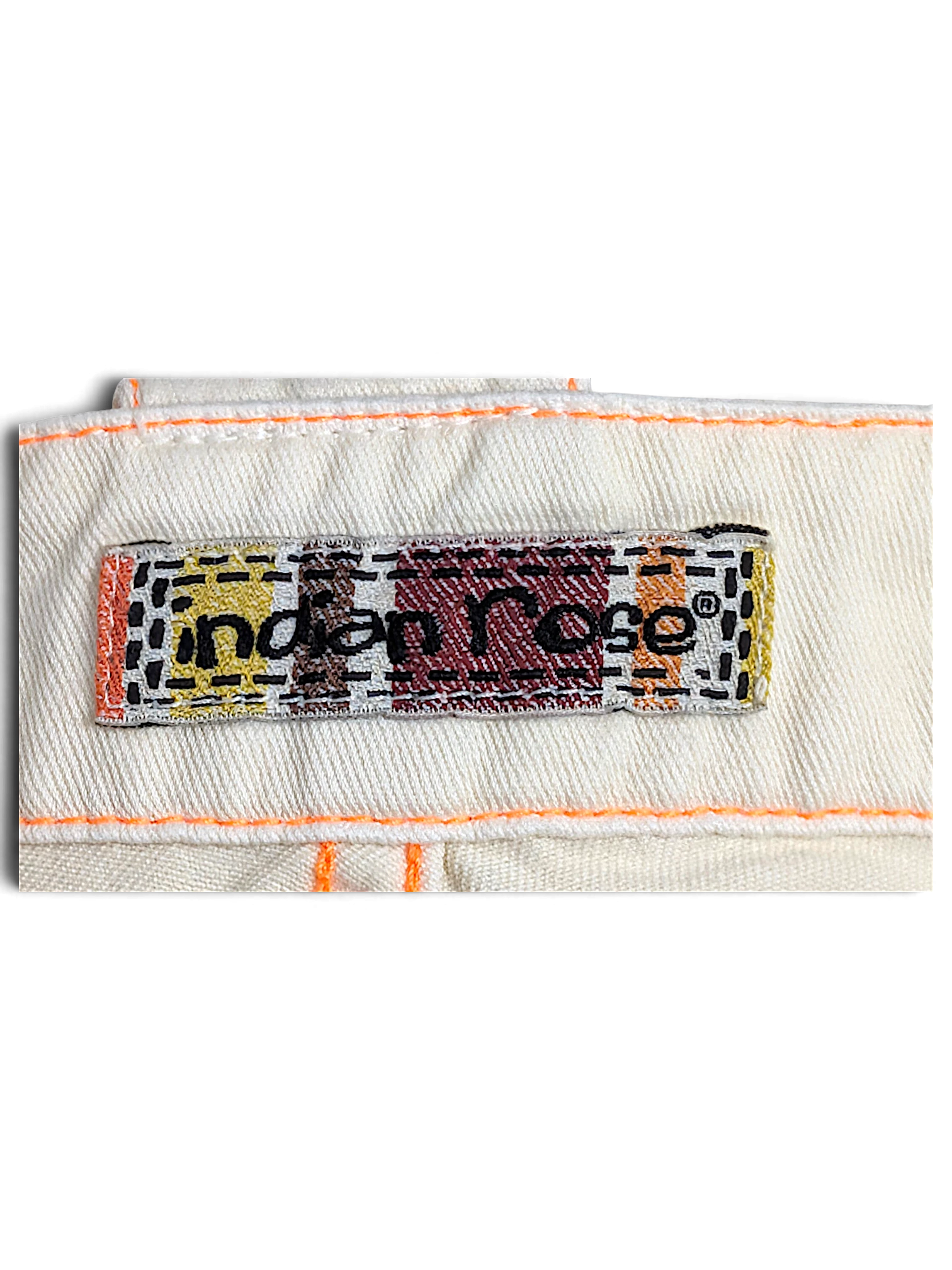JAKE & IPI Indian Rose white cargo pants brand label with orange contrast stitching on cotton fabric
