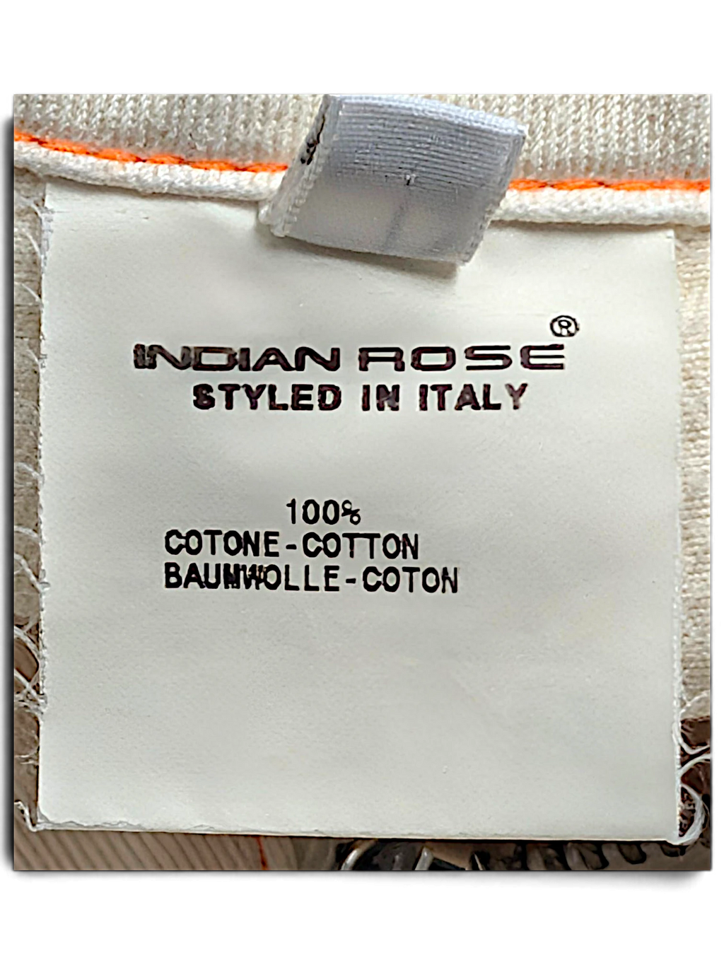 JAKE & IPI Indian Rose white cargo pants garment care label showing 100 percent cotton composition and Italian origin