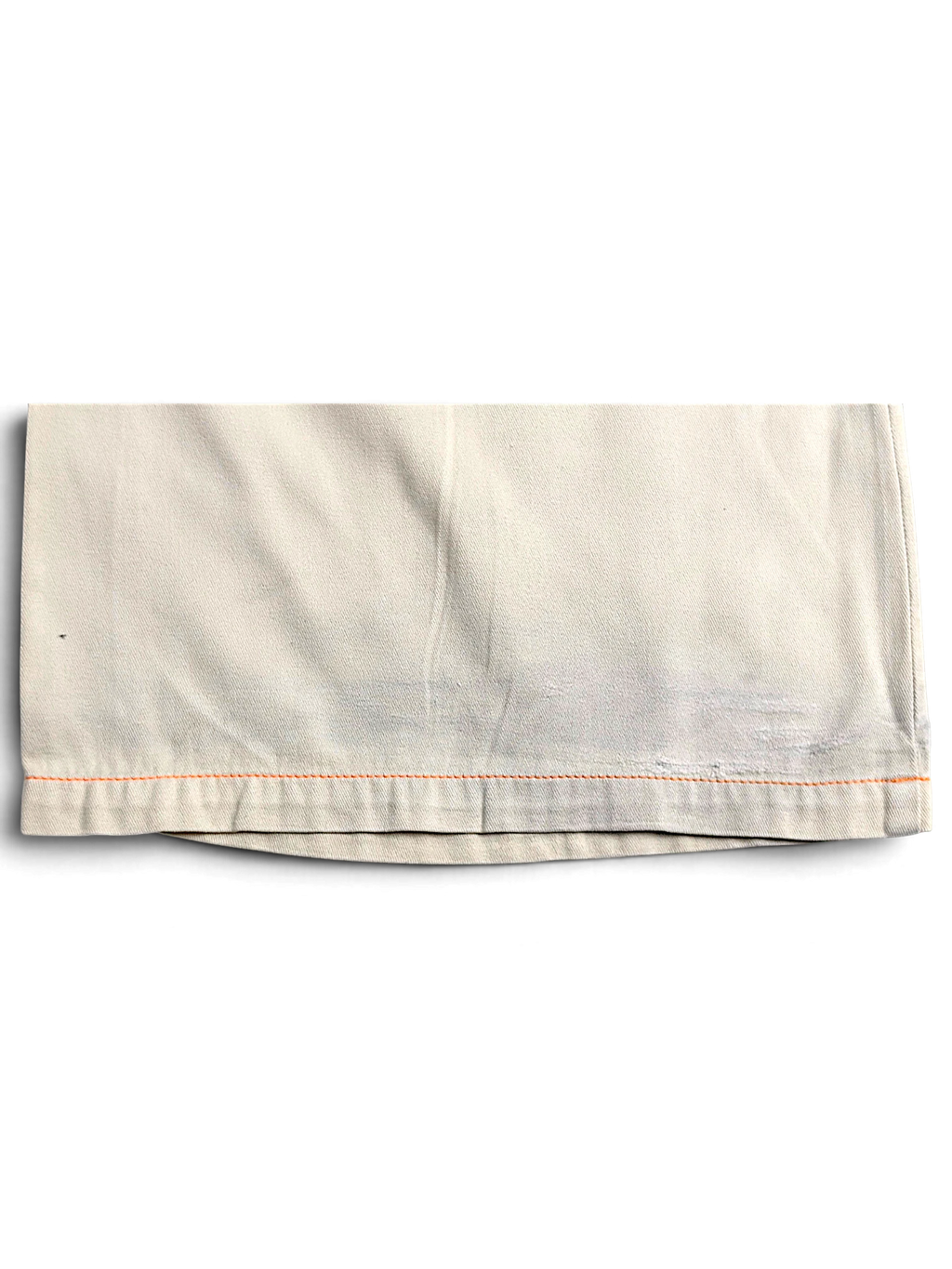 JAKE & IPI Indian Rose white cotton cargo pant hem with orange contrast stitching and visible wear marks