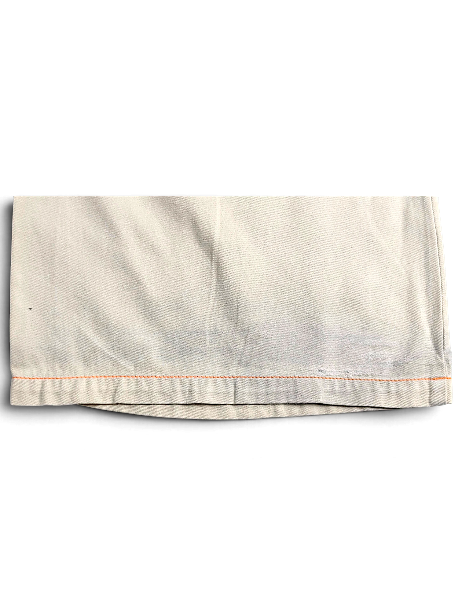 JAKE & IPI Indian Rose white cotton cargo pant hem with orange contrast stitching and visible wear marks