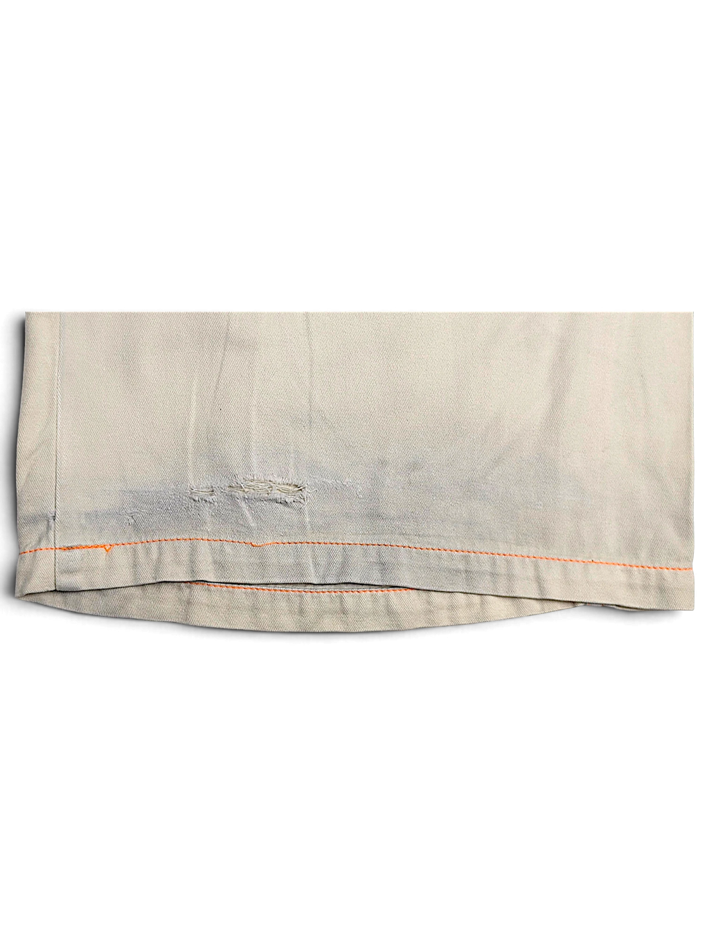 JAKE & IPI Indian Rose white cotton cargo pants hem detail showing orange contrast stitching and fabric wear