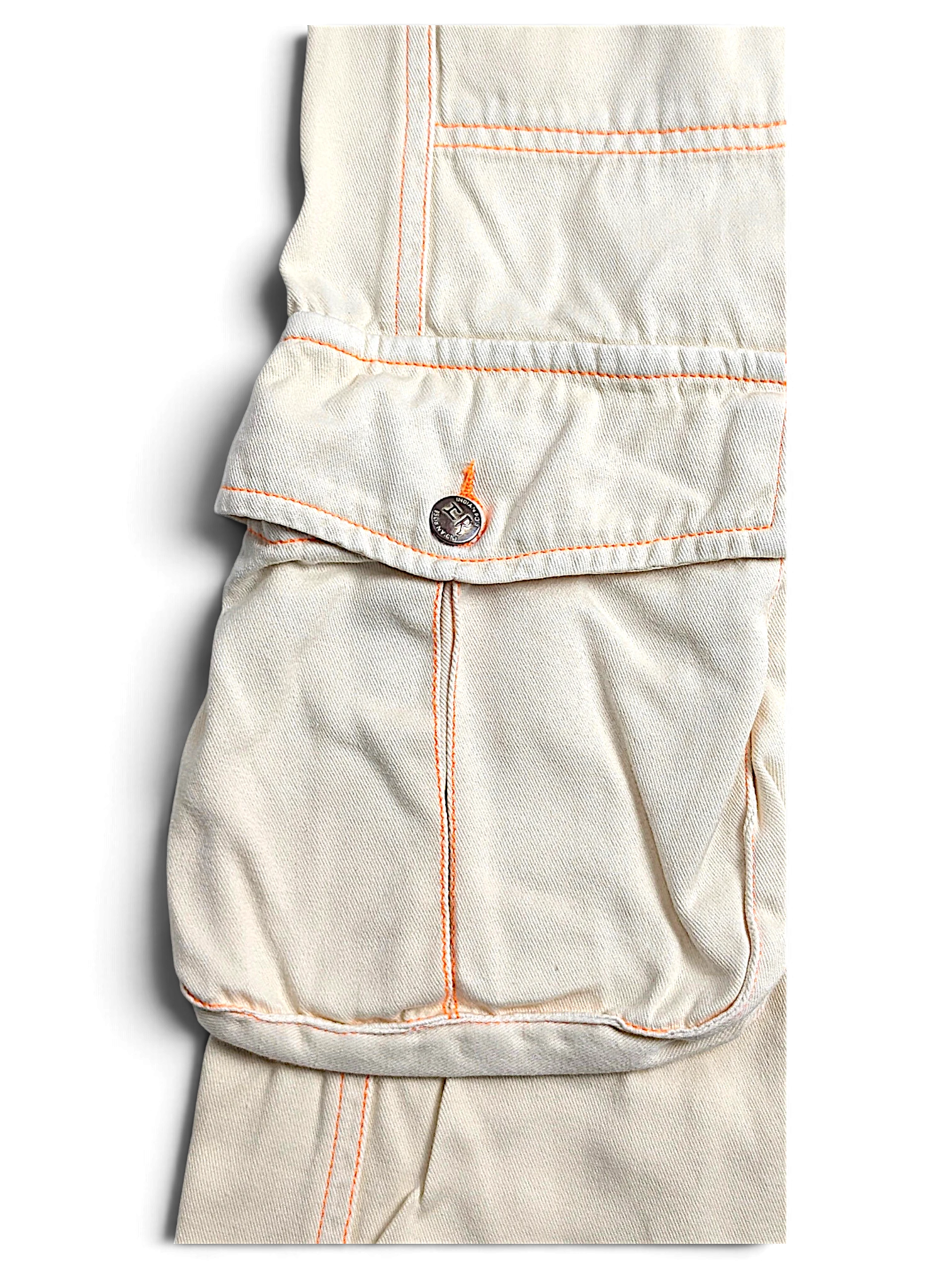 JAKE & IPI Indian Rose white cotton cargo pants featuring orange contrast stitching and a utility pocket detail.