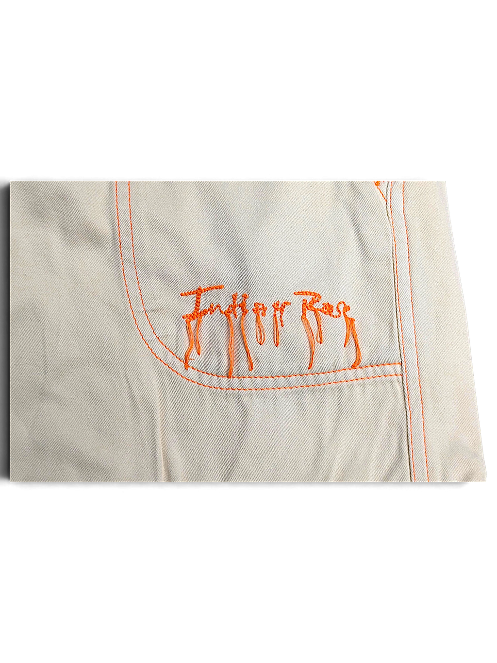 JAKE & IPI Indian Rose white cotton cargo pants pocket detail with orange contrast stitching and embroidered logo