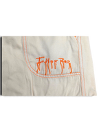 JAKE & IPI Indian Rose white cotton cargo pants pocket detail with orange contrast stitching and embroidered logo