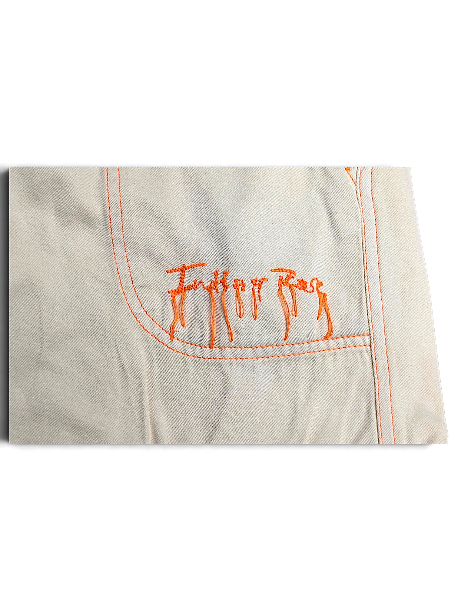 JAKE & IPI Indian Rose white cotton cargo pants pocket detail with orange contrast stitching and embroidered logo