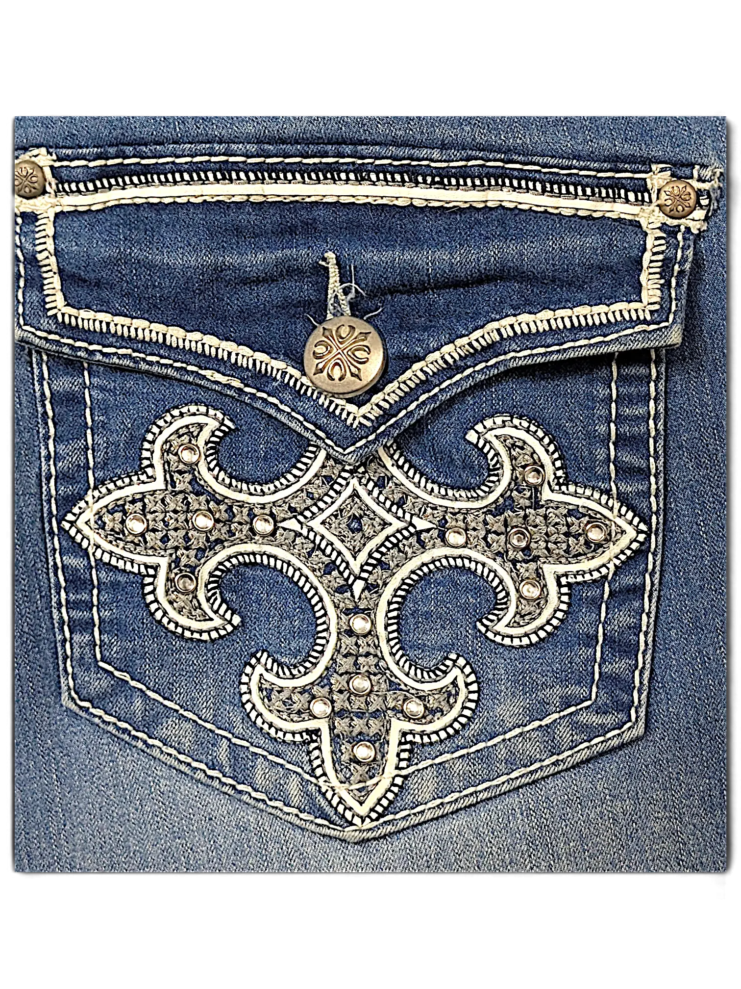 JAKE & IPI indigo Y2K jeans featuring a back pocket with ornate silver embroidery, contrast stitching, and studs.