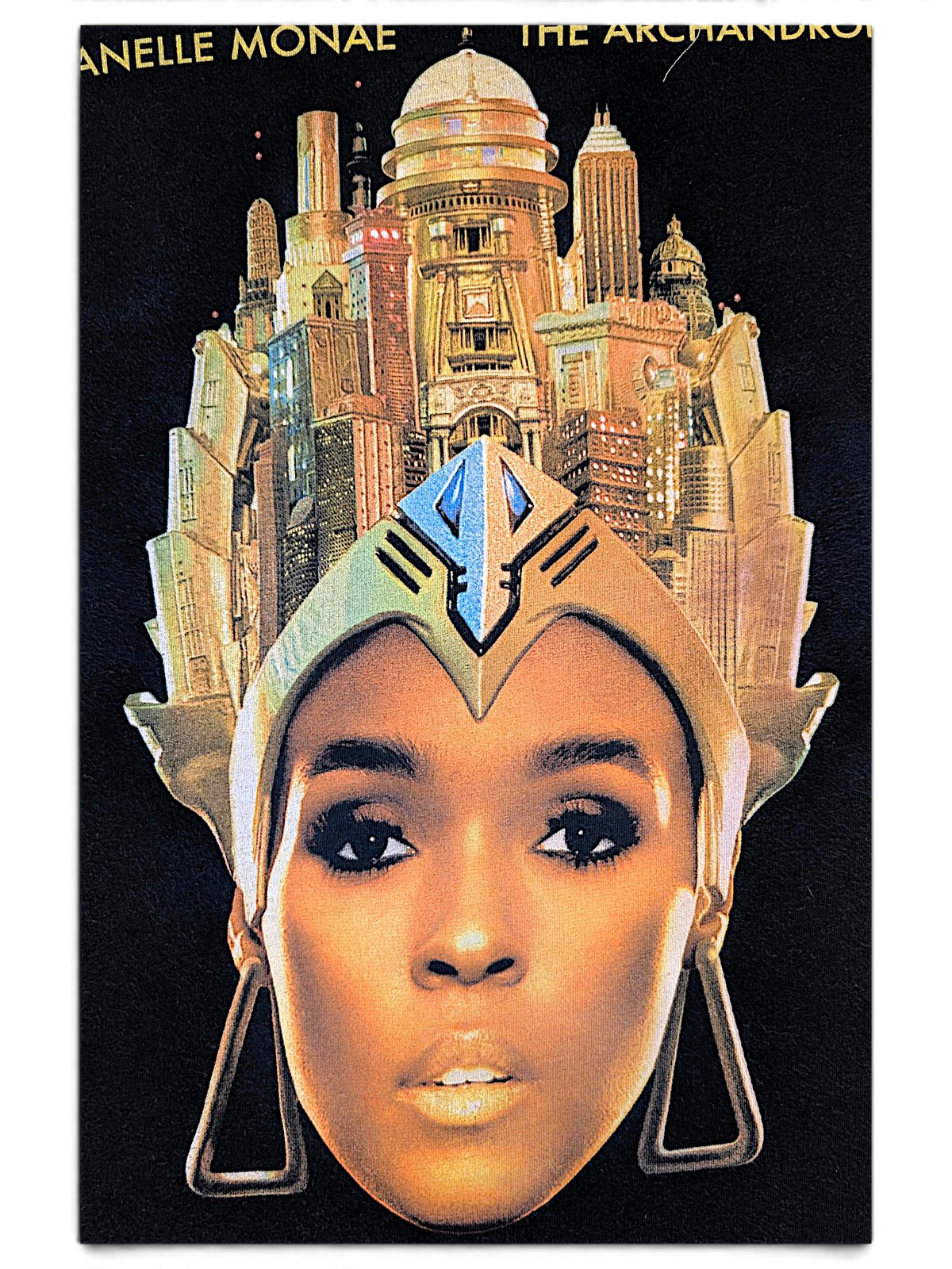 JAKE & IPI black cotton band t-shirt featuring a graphic print of Janelle Monáe with a futuristic city crown.