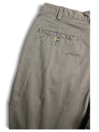 JAKE & IPI Jeanswest light grey taupe cotton pleated trousers with a single buttoned back pocket detail.