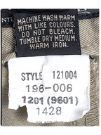 JAKE & IPI Jeanswest trousers care label showing style number 121004 and washing instructions on light grey fabric