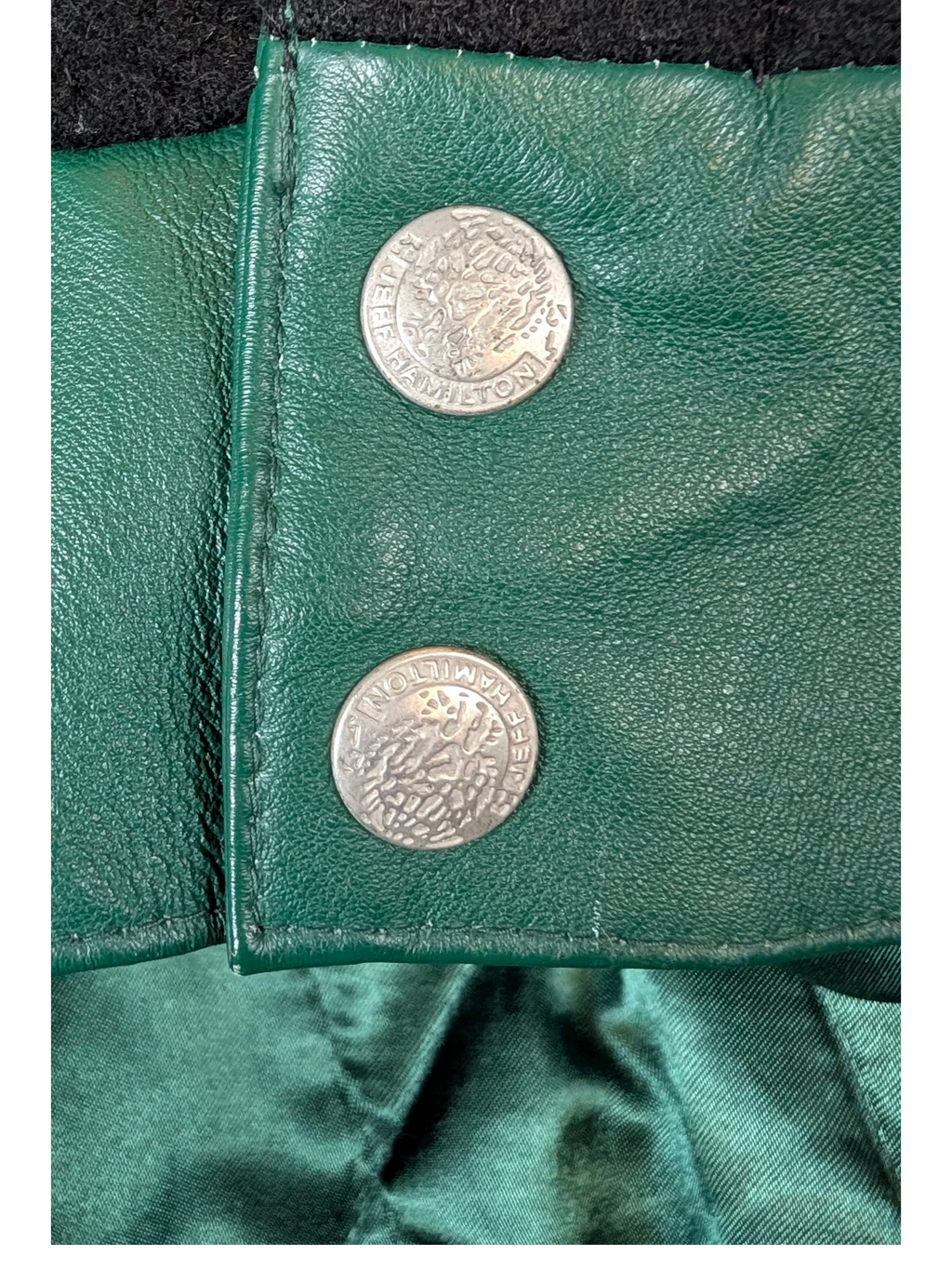 JAKE & IPI Jeff Hamilton varsity jacket featuring green leather and silver embossed snap buttons