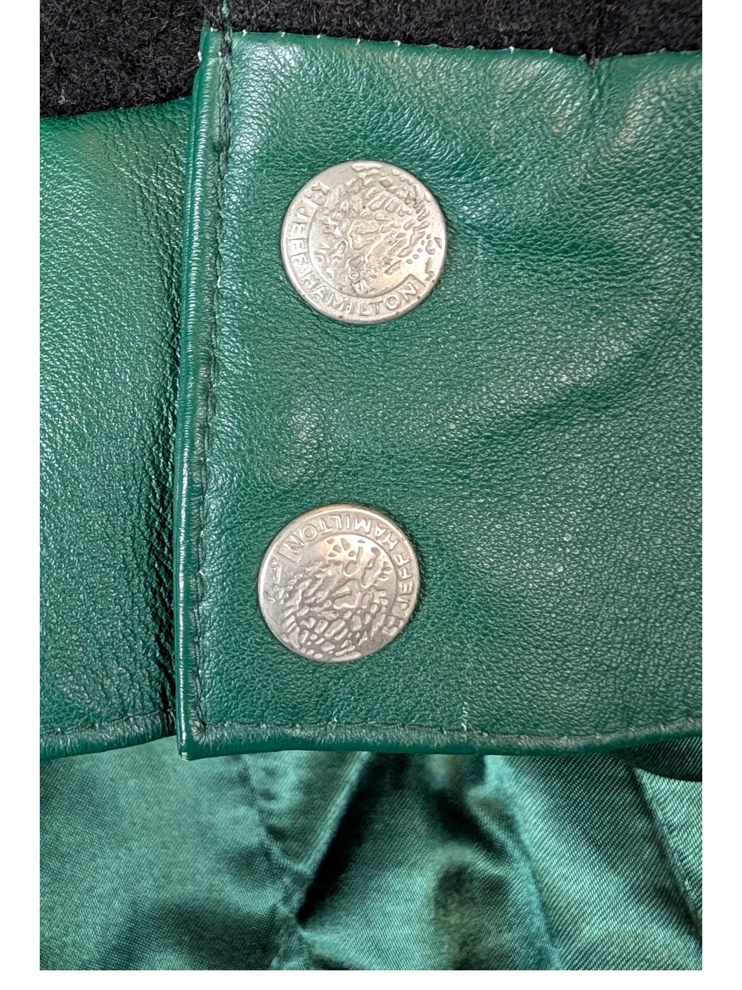JAKE & IPI Jeff Hamilton varsity jacket featuring green leather and silver embossed snap buttons