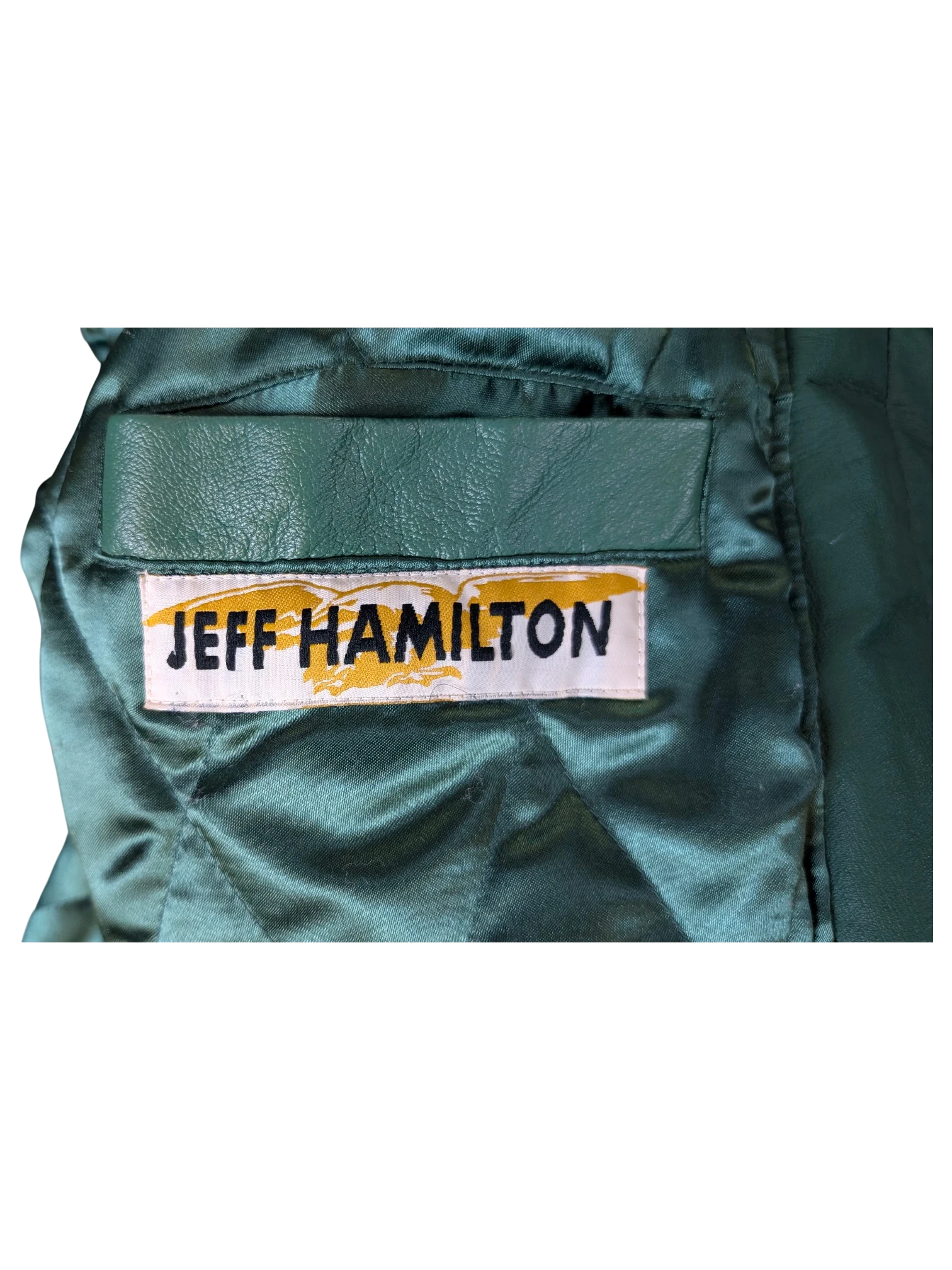 JAKE & IPI Jeff Hamilton varsity jacket interior featuring green quilted lining and leather pocket detail