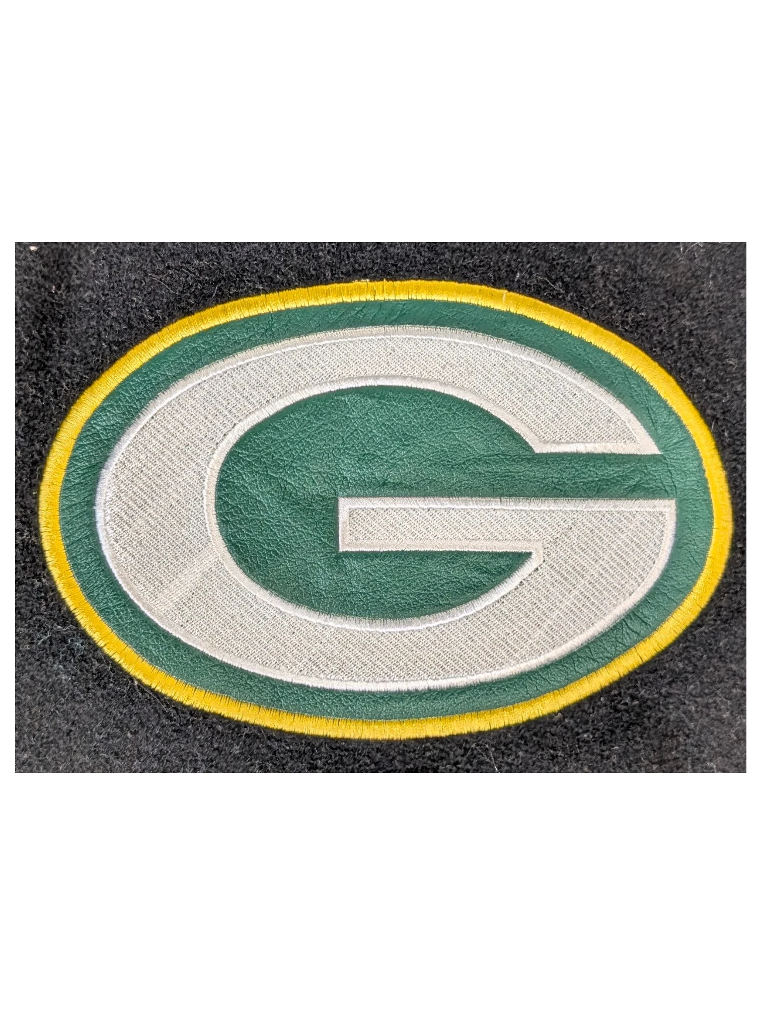 JAKE & IPI Jeff Hamilton varsity jacket featuring a green, yellow, and white leather Green Bay Packers G logo patch.
