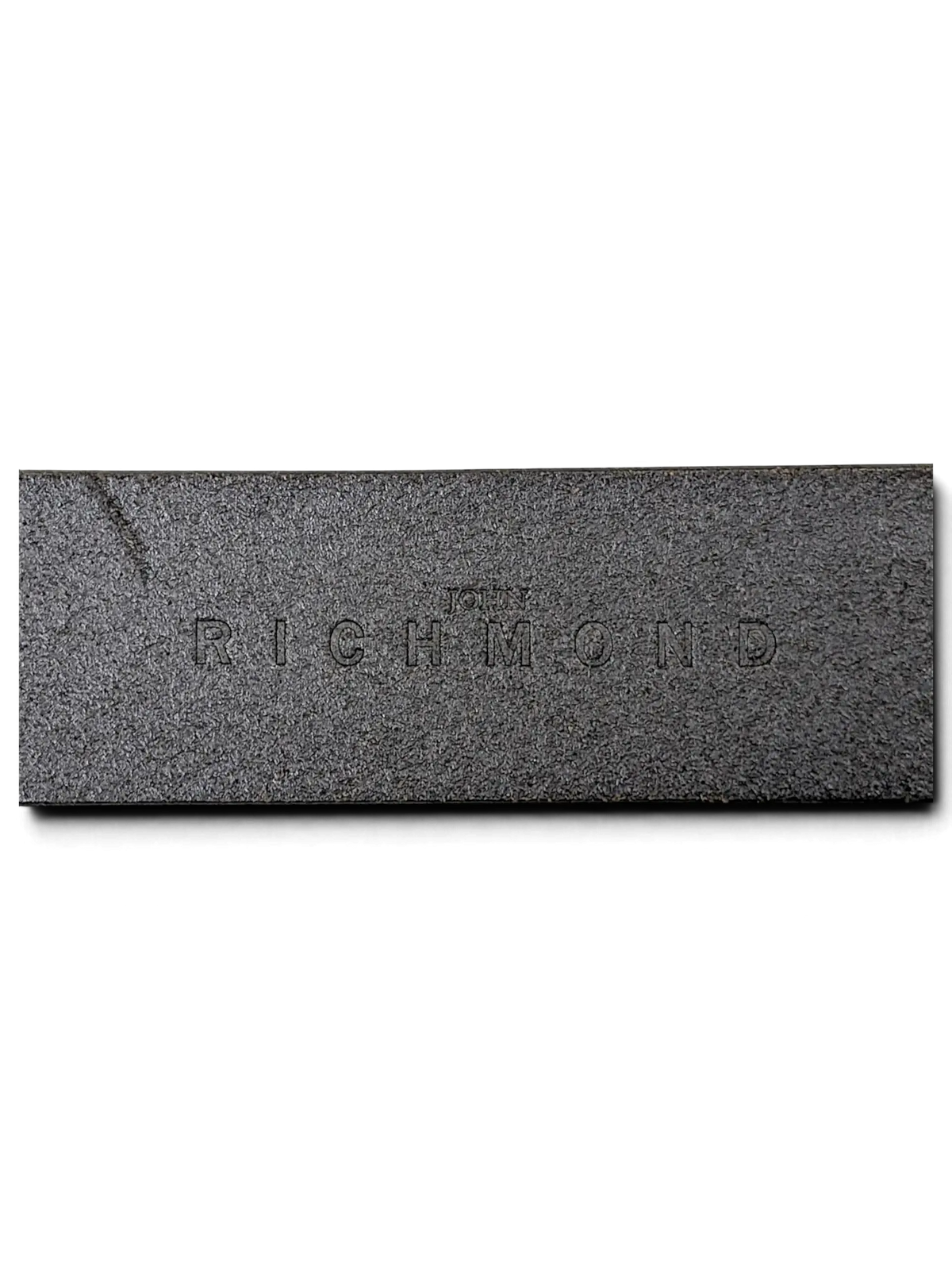 JAKE & IPI John Richmond black leather belt featuring an embossed logo detail on the textured strap