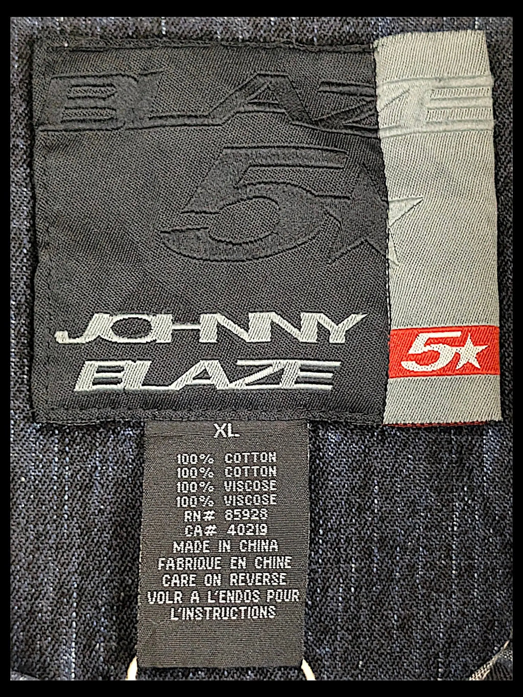 JAKE & IPI Johnny Blaze denim jacket interior label showing size XL and 100 percent cotton material composition