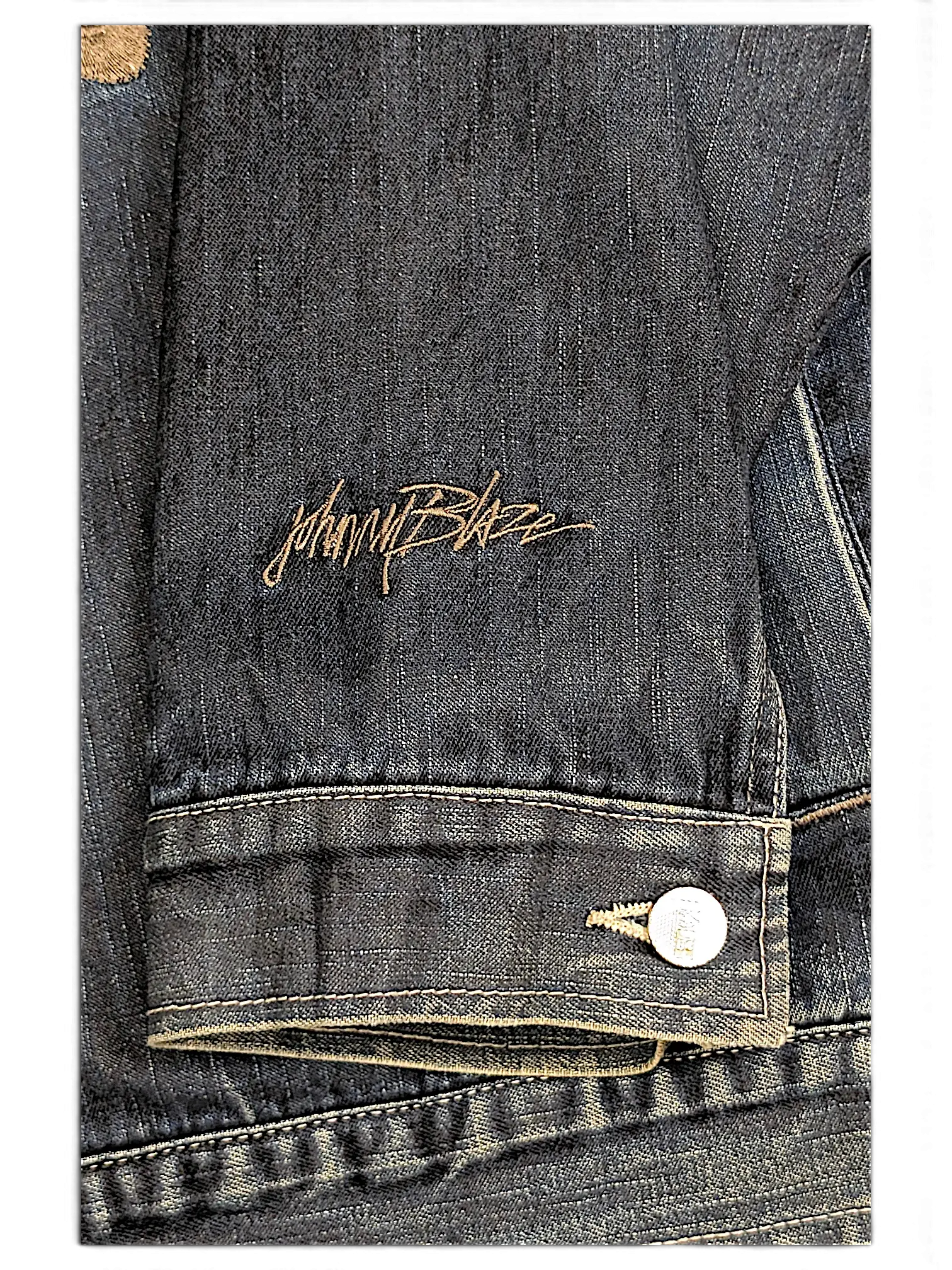JAKE & IPI Johnny Blaze dark wash denim jacket sleeve with embroidered logo detail and metallic button cuff