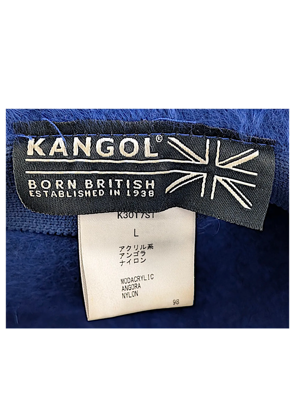 JAKE & IPI Kangol Fugora -ämpärihatun sisäpuolen tuotemerkki ja pesuohjelappu, jossa näkyy materiaalitiedot