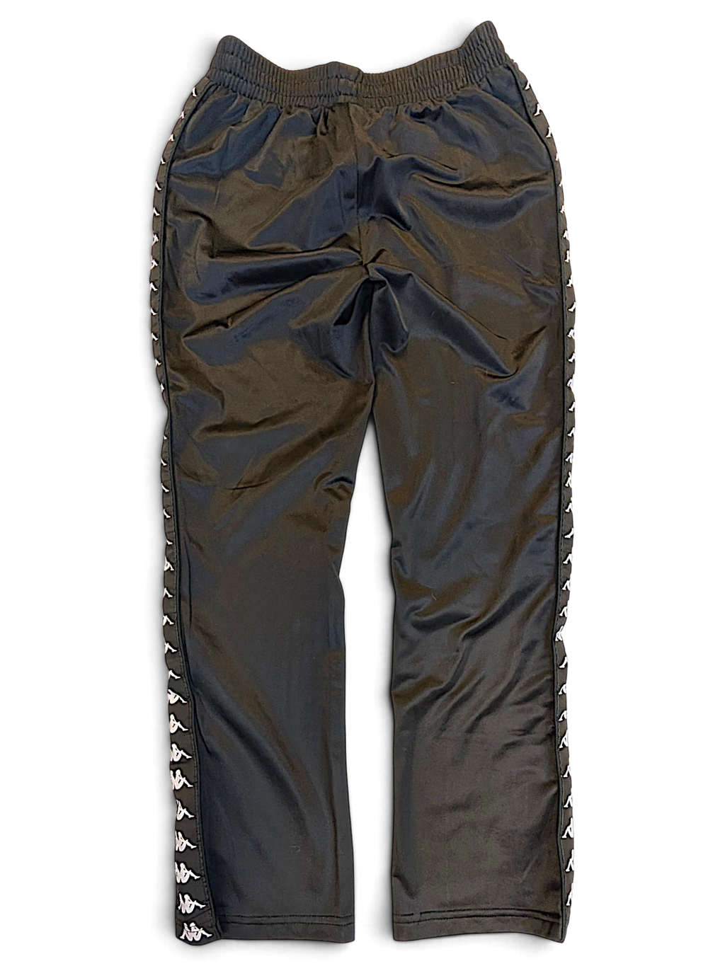 JAKE & IPI pre-owned black Kappa track pants with white Omini logo tape down the sides in size small.