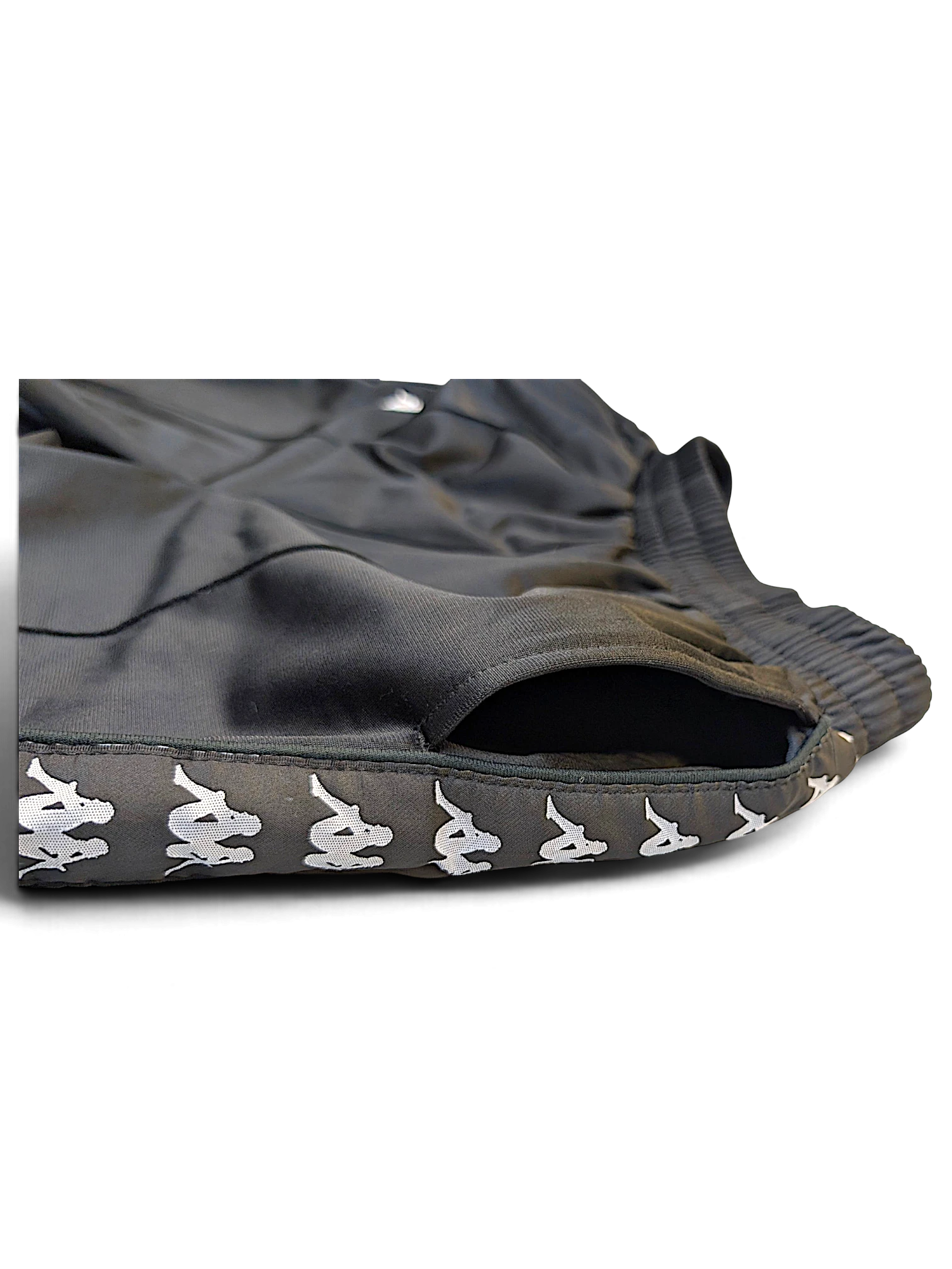 JAKE & IPI pre-owned black Kappa track pants with white Omini logo tape detail along the side pocket