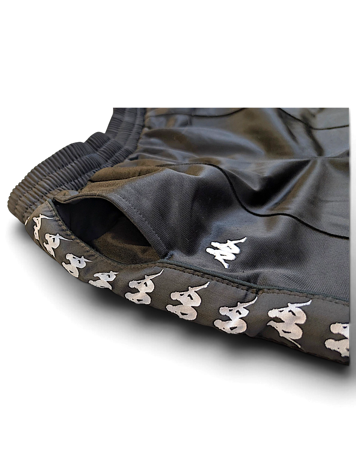 JAKE & IPI pre-owned Kappa black track pants with white Omini logo tape side detailing and elasticated waistband