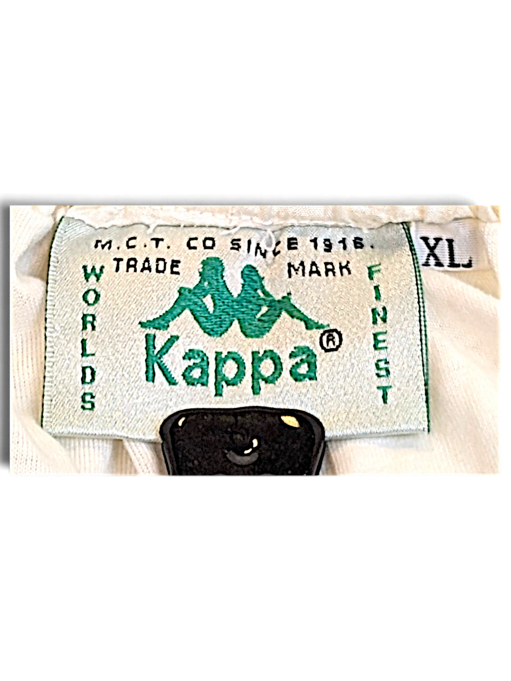 JAKE & IPI Kappa brand clothing label in green and white with size XL tag on retro track pants