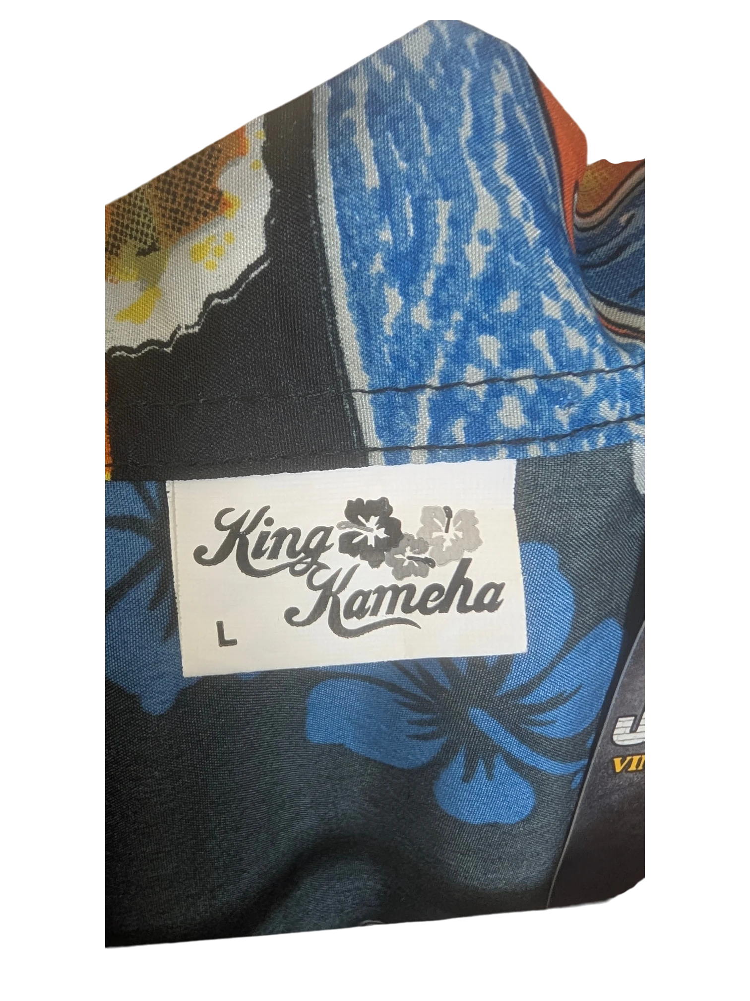 JAKE & IPI King Kahema Hawaiian shirt featuring a black fabric with a vibrant blue floral and tropical print