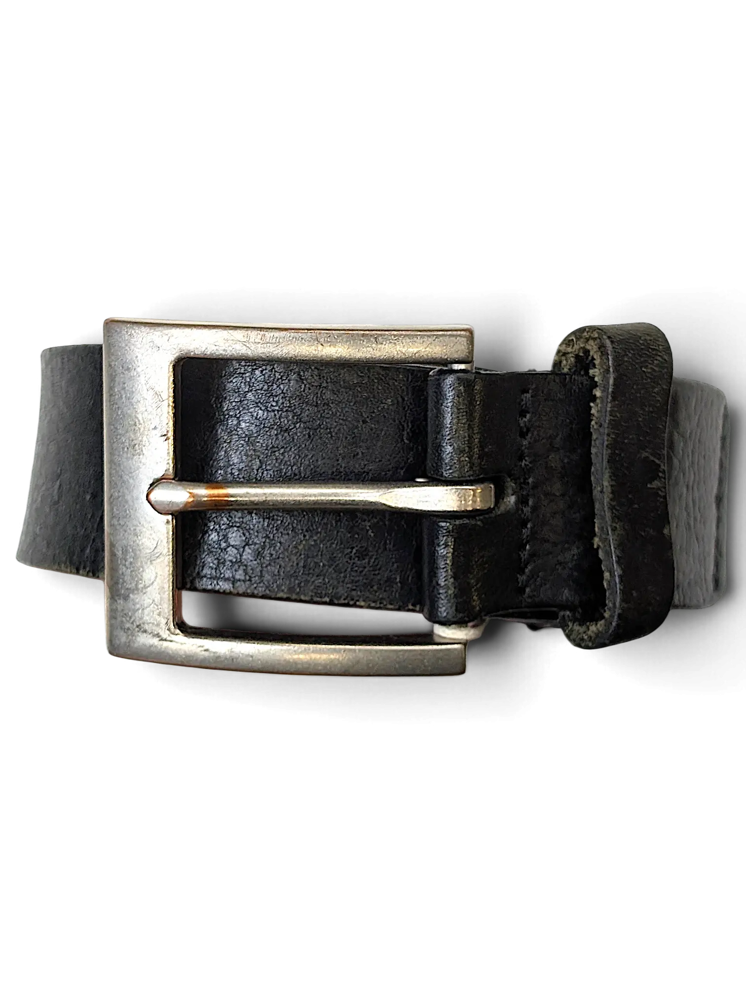 JAKE & IPI Konfection black leather belt featuring a brushed silver metal buckle held in a hand.