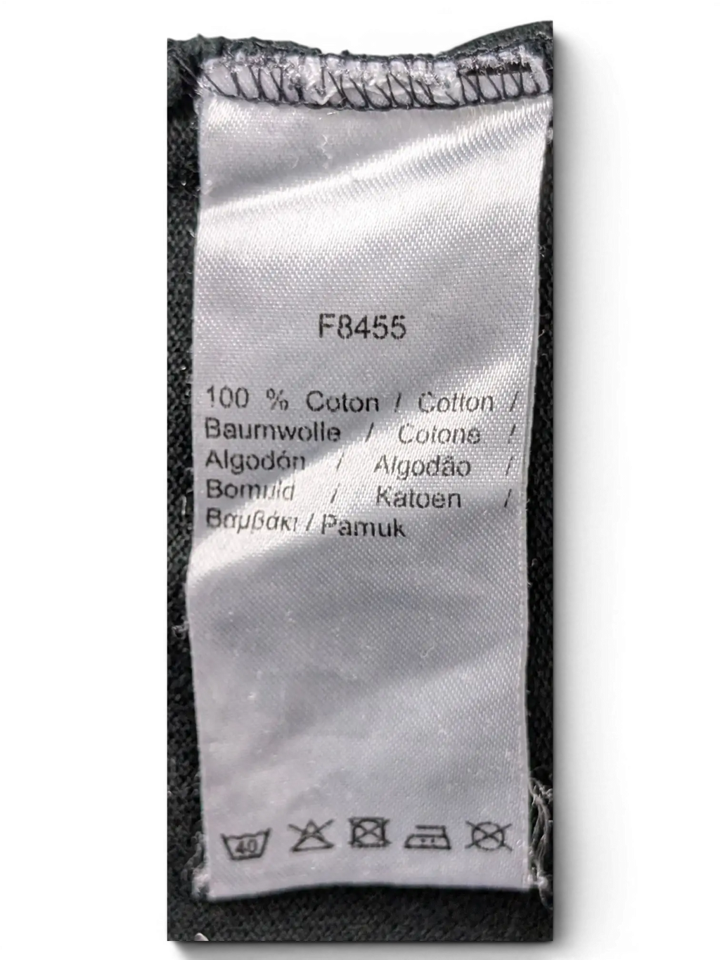 JAKE & IPI Lacoste black polo shirt 100 percent cotton fabric care label with washing instructions