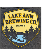 JAKE & IPI charcoal grey hoodie featuring a Lake Ann Brewing CO logo with a canoe and pine tree graphic