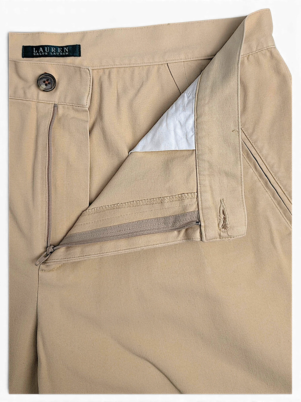 JAKE & IPI Lauren Ralph Lauren beige tailored trousers featuring front pleats and a buttoned zip fly closure.