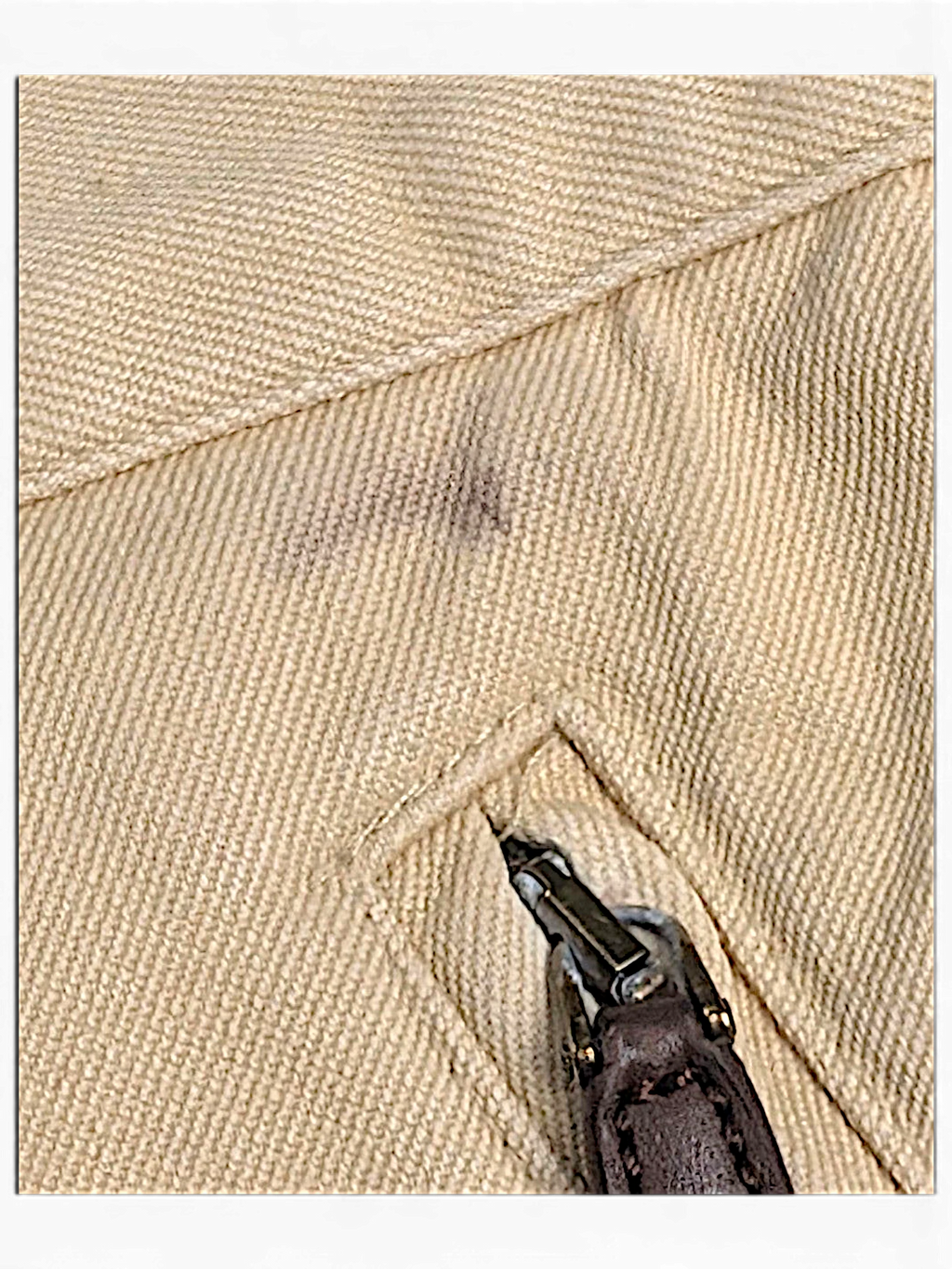 JAKE & IPI Lauren Ralph Lauren beige trousers showing a dark stain near the zippered pocket detail