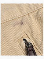 JAKE & IPI Lauren Ralph Lauren beige trousers showing a dark stain near the zippered pocket detail